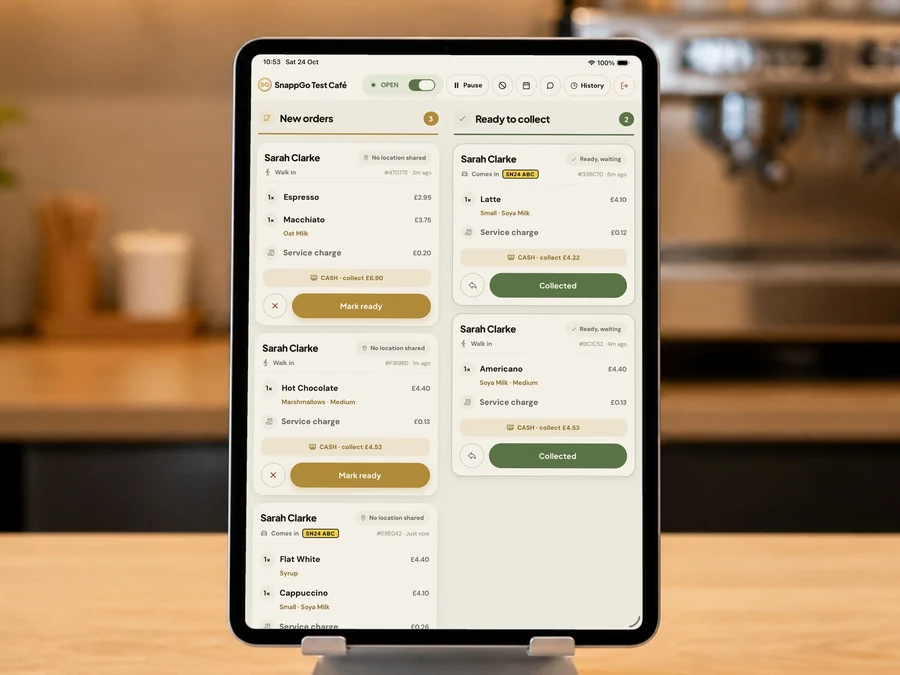 The SnappGo counter tablet on its stand, showing new orders and orders ready to collect